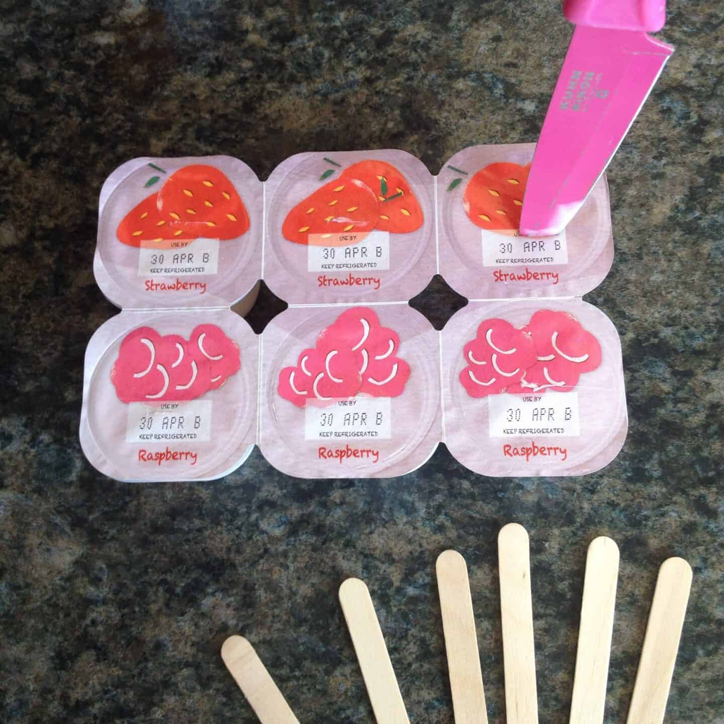 Pierce the centres of each yoghurt with a knife.