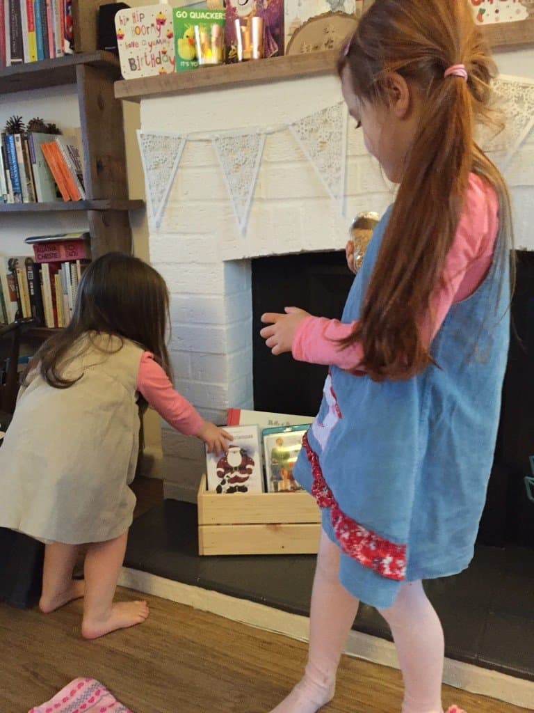 Thea and Ava opening the Christmas Eve Box