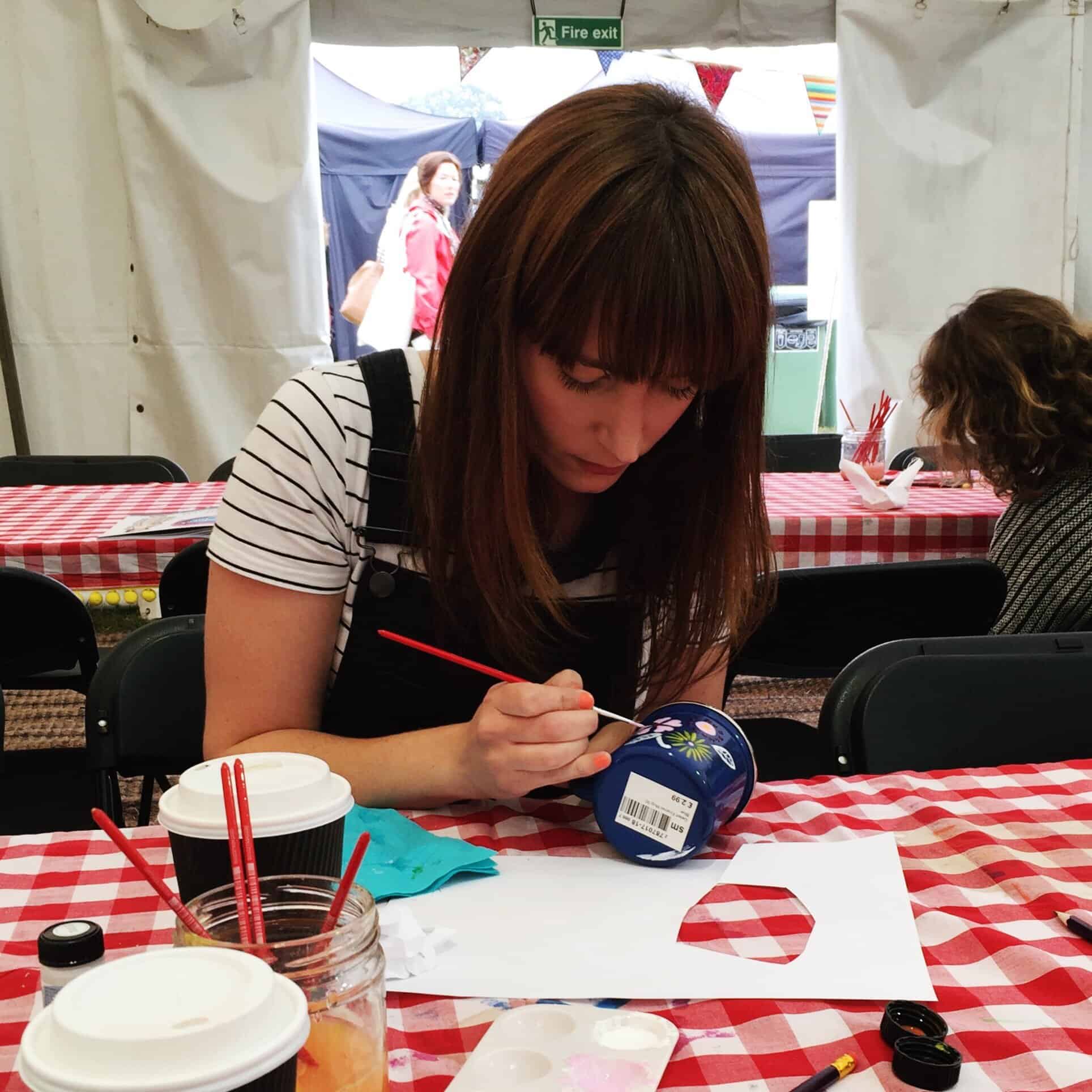 Becky painting a mug at The Lovely Drawer workshop at The Handmade Fair
