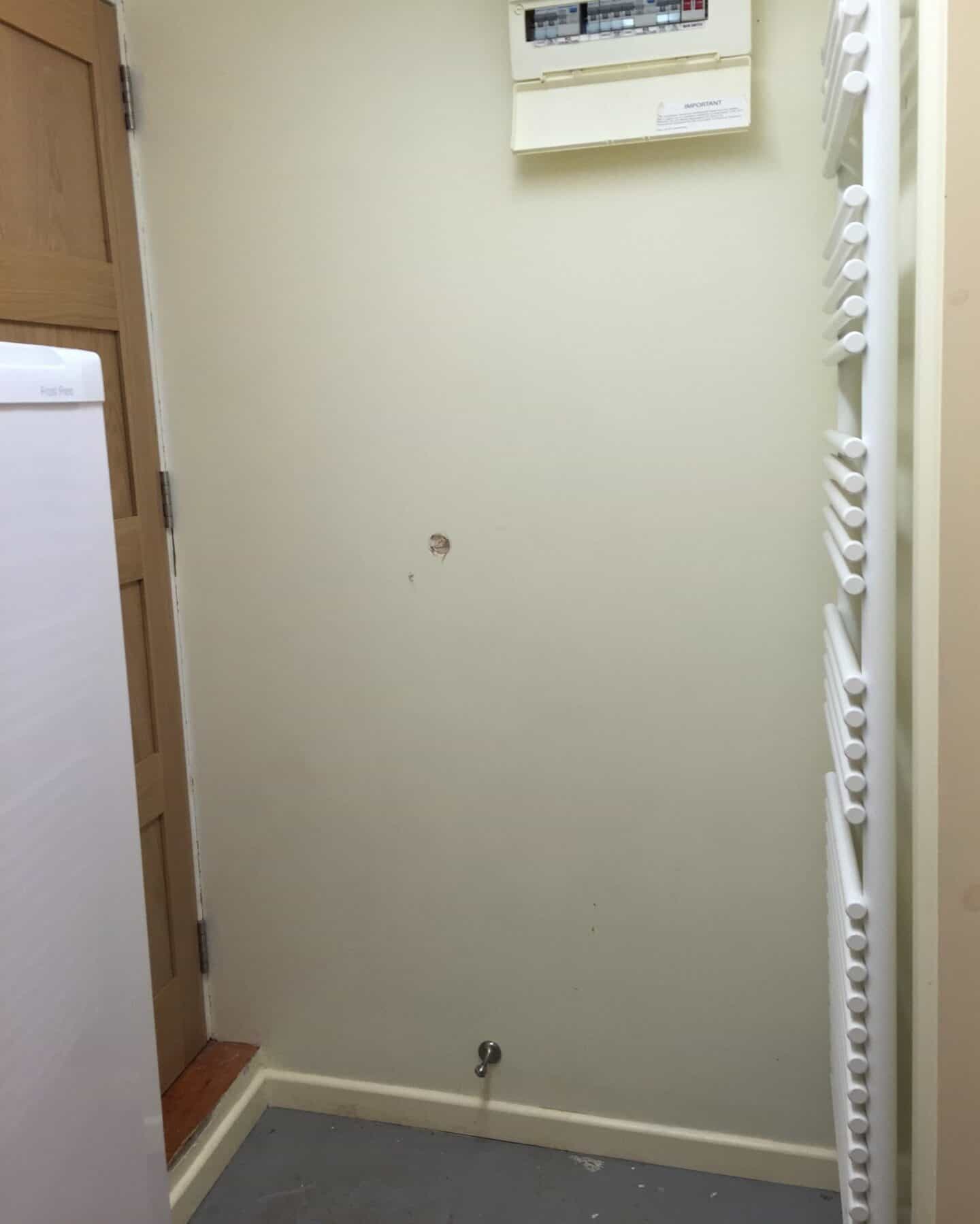 Dingy utility room before the makeover