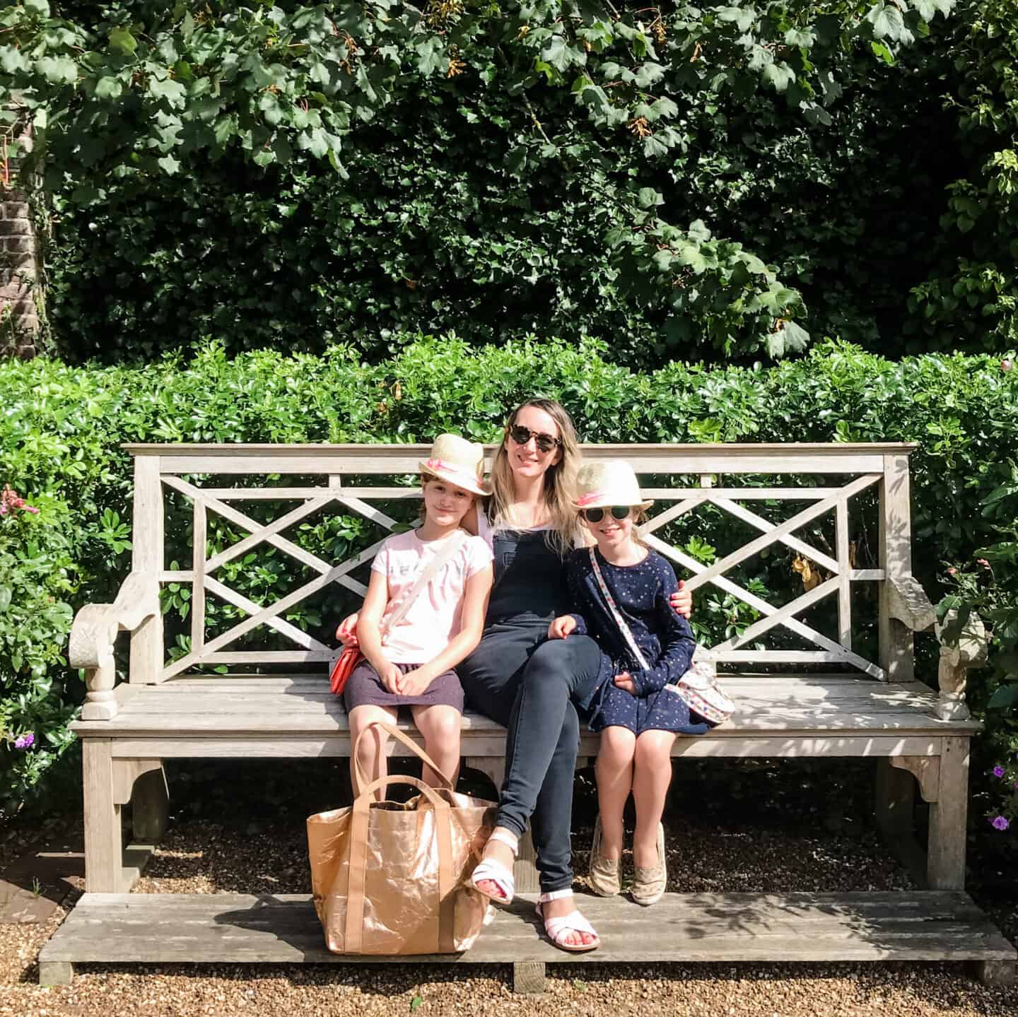 Becky Pink and her daughters sitting on a bench