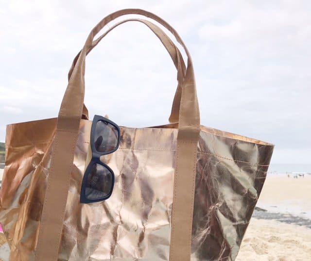 Sustainable Tote Bag in Rose Rose Gold by My Paper Tote with sunglasses on a beach