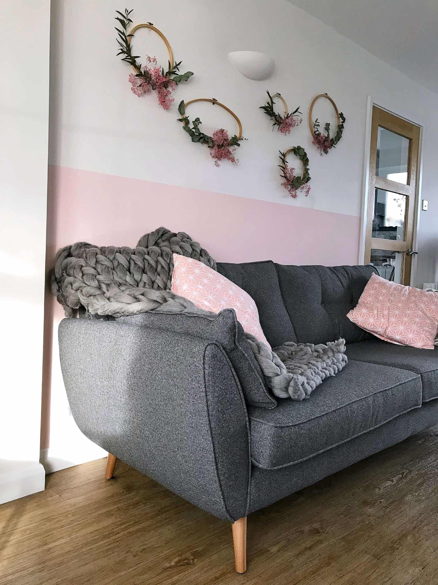 Charcoal Zinc DFS sofa with pink wall and cushions