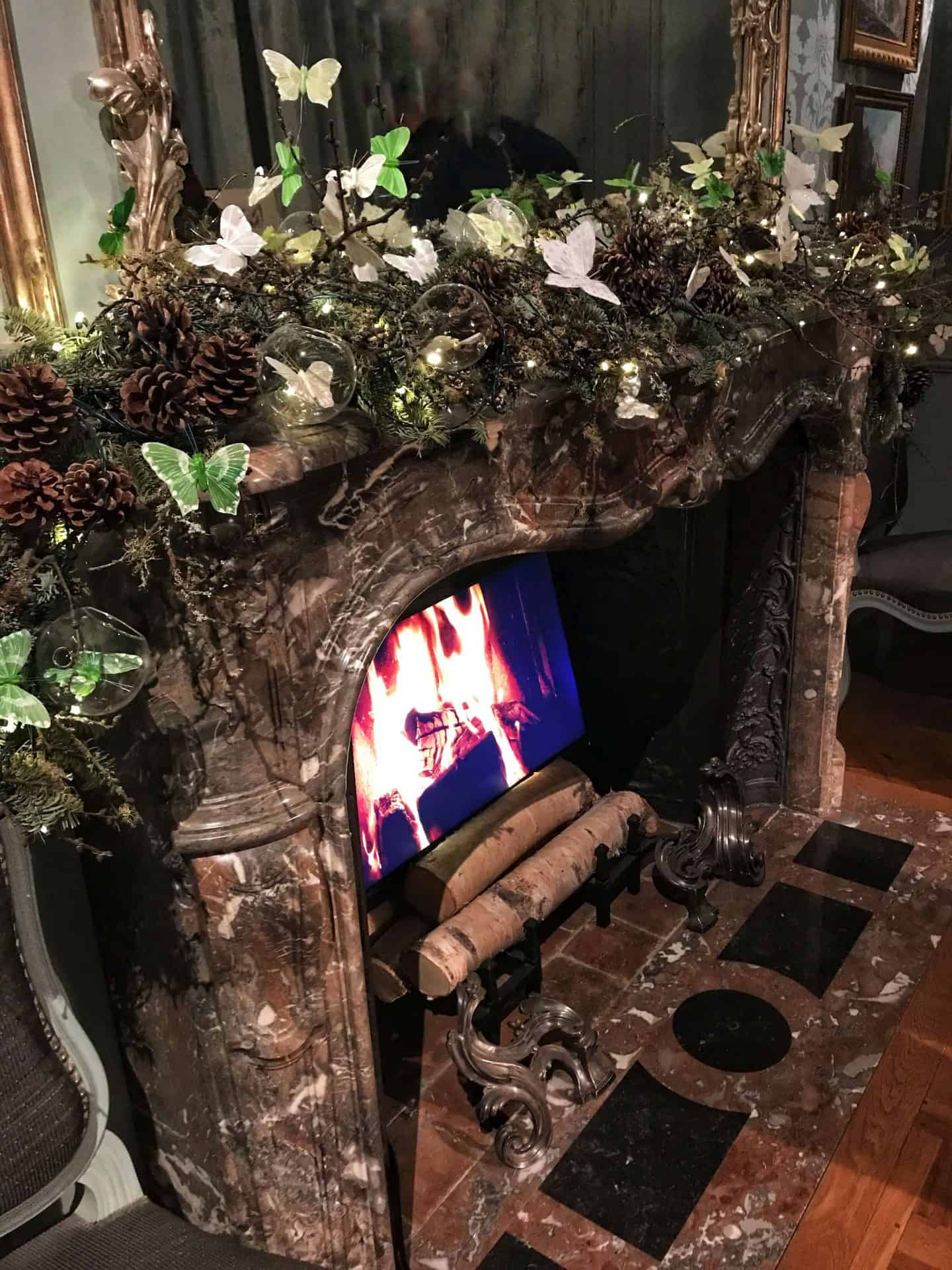 Cosy decorated fireplace at Waddesdon Manor at Christmas