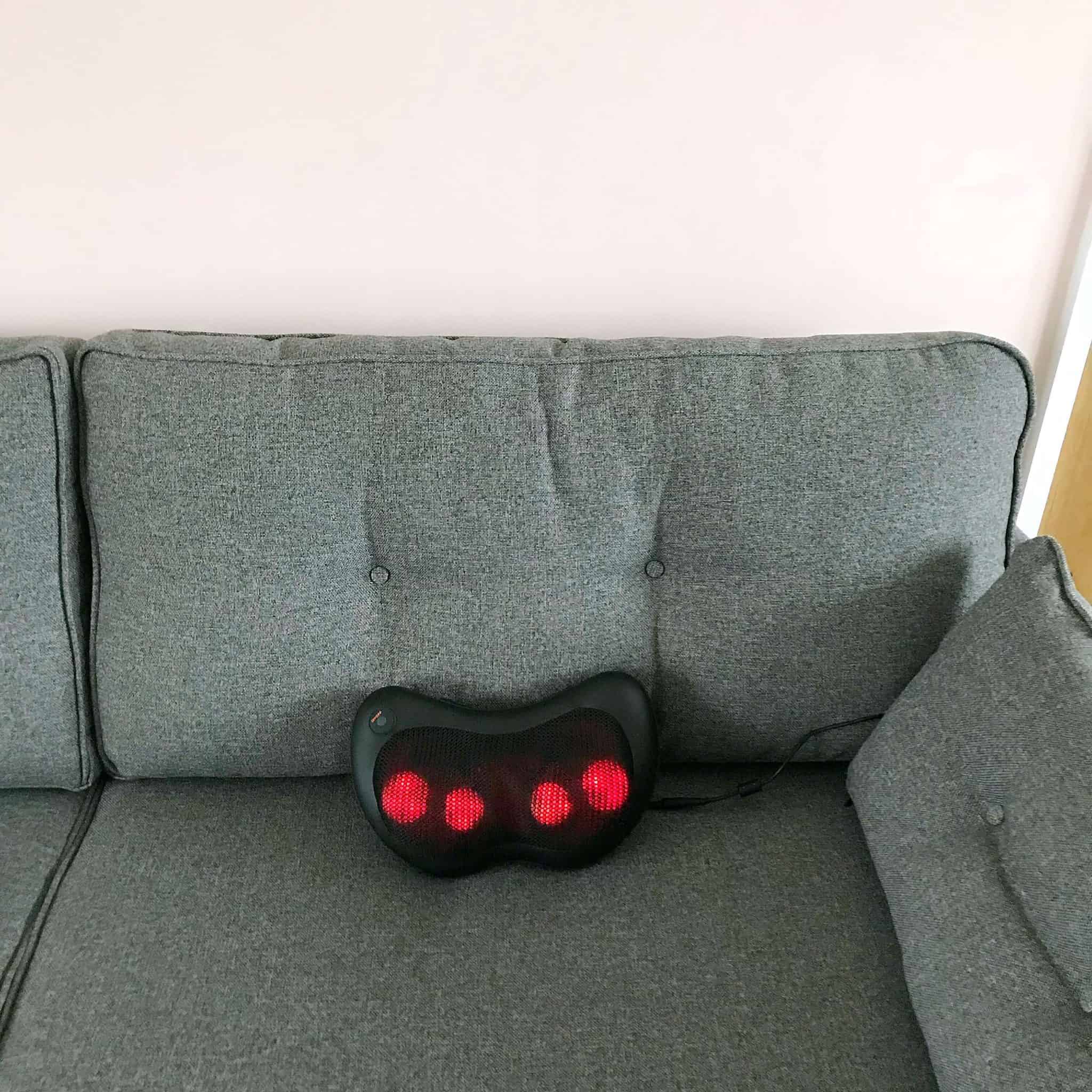 Naipo Neck and Back Massager on a sofa