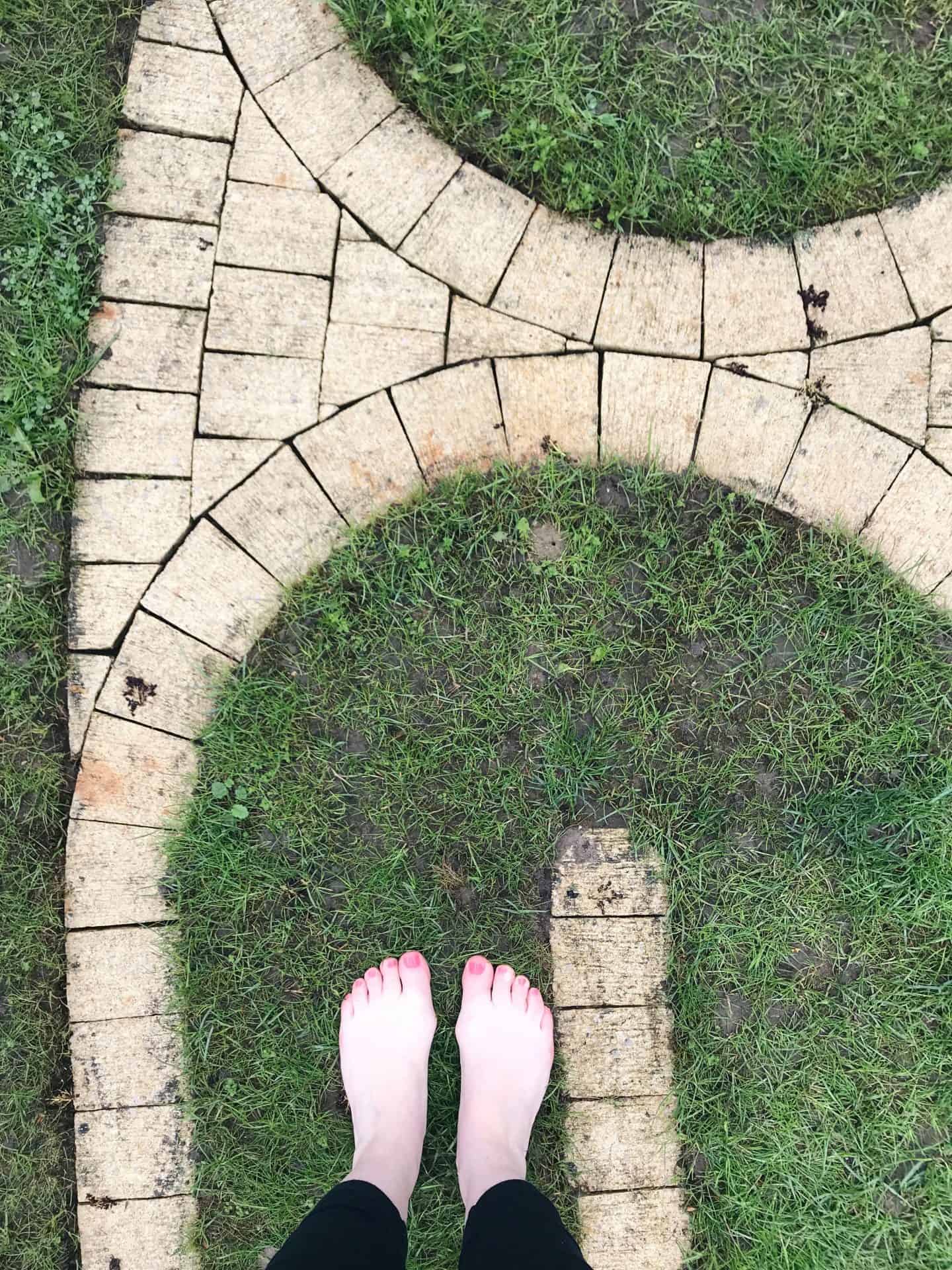 Walking bare foot on the labyrinth at Tofte Manor on the Mama Retreat