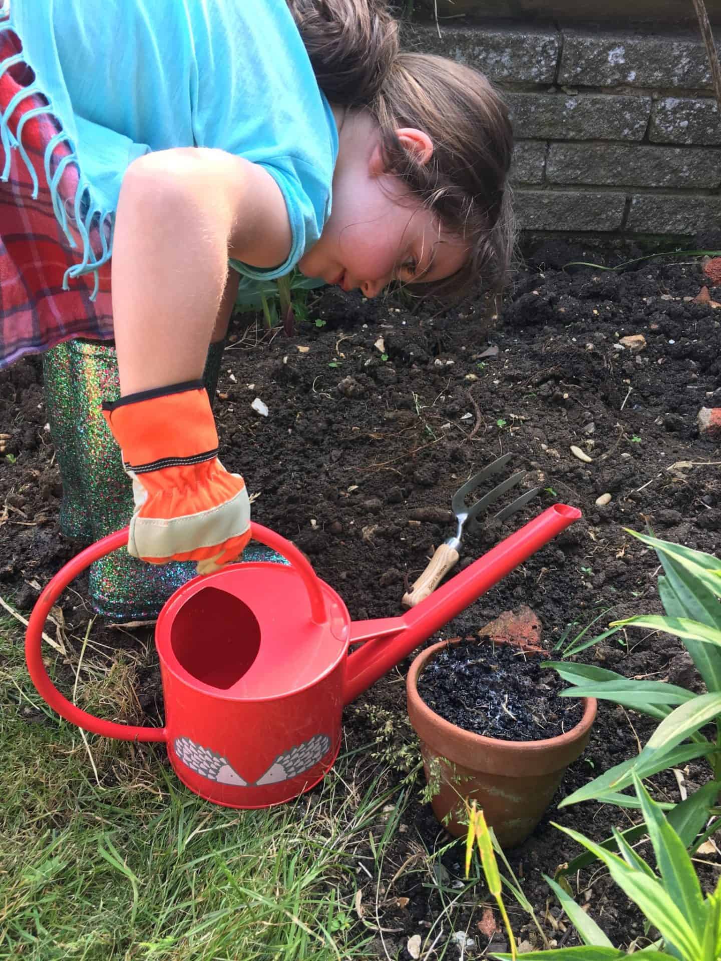 Watering plants for #GetThemGrowing for National Children's Gardening Week