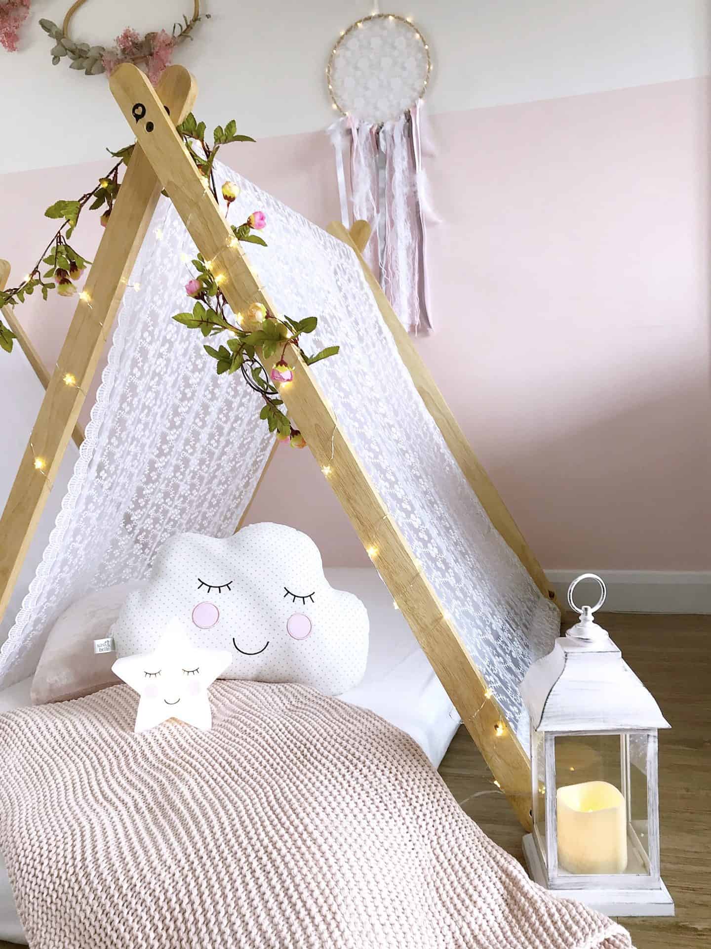 Cosy white wood-framed tent at our kids tee pee party