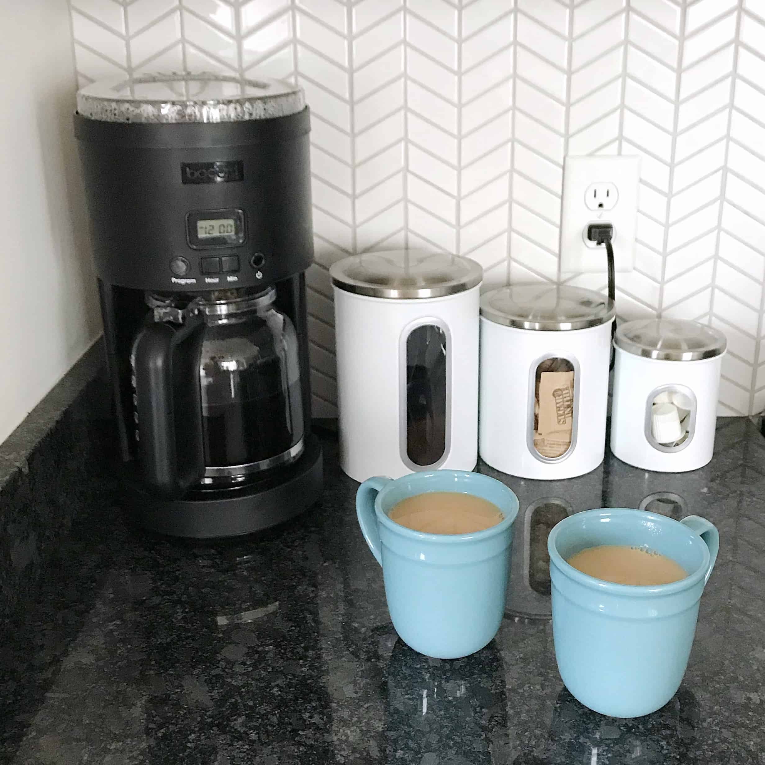 Coffee maker and cups in a monochrome kitchen