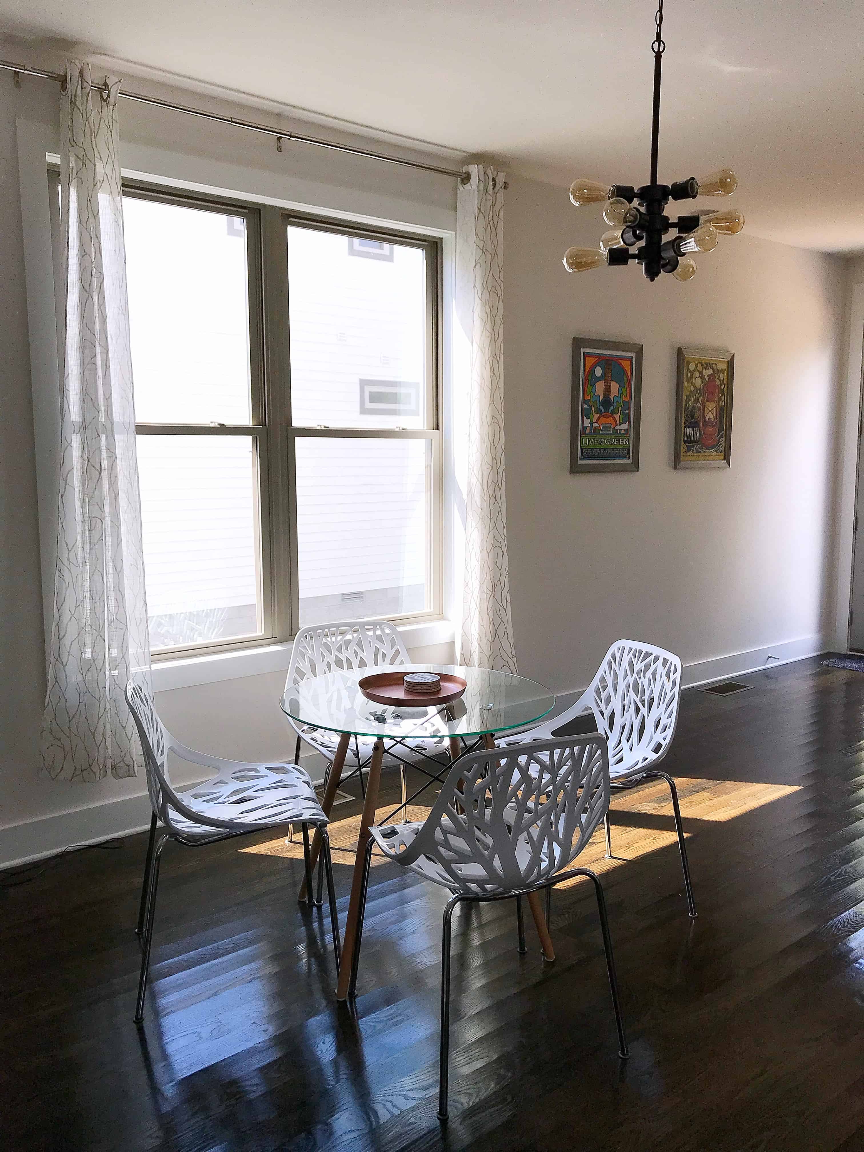 Dining table with white tree pattern chairs