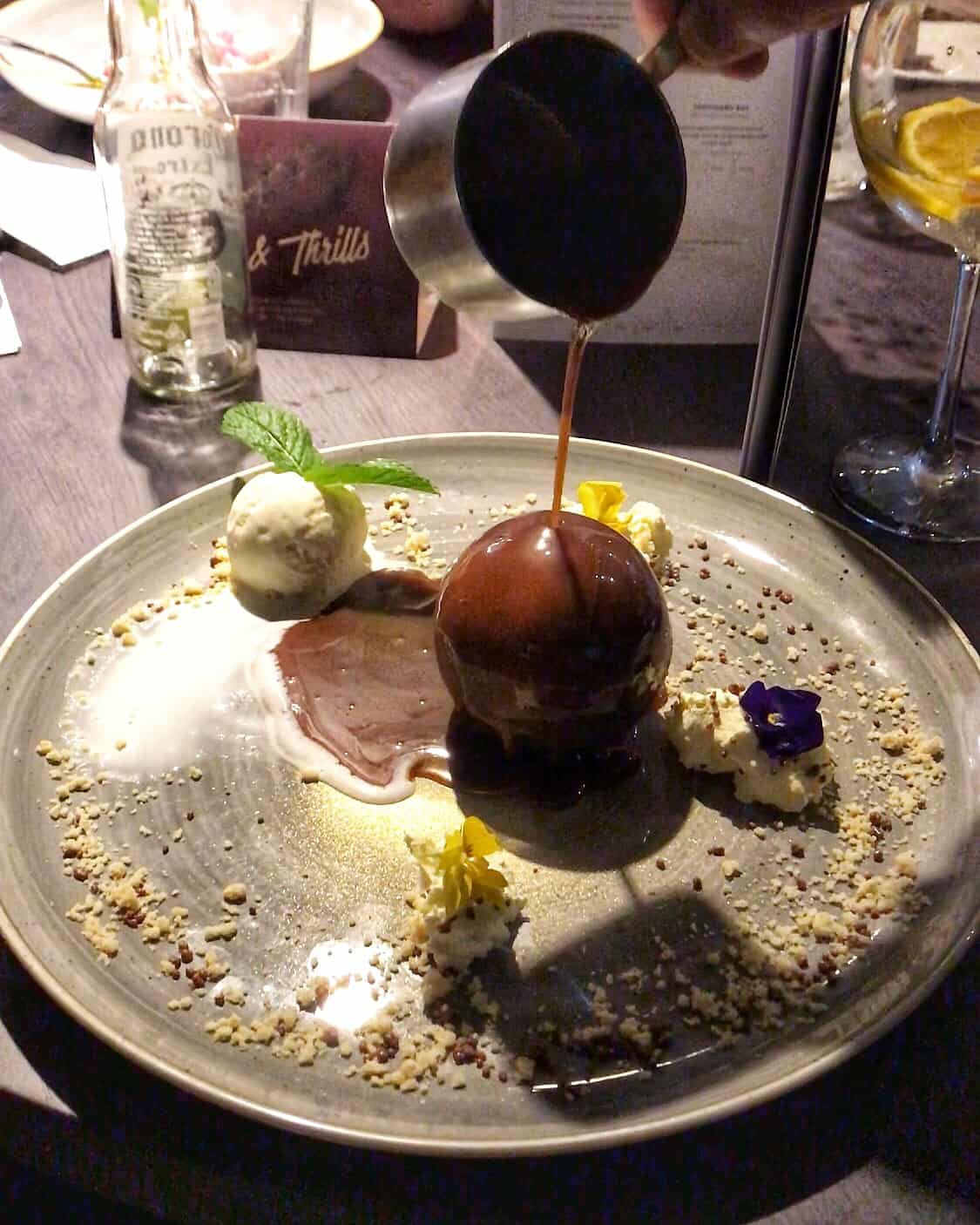 Chocolate bomb with salted caramel sauce