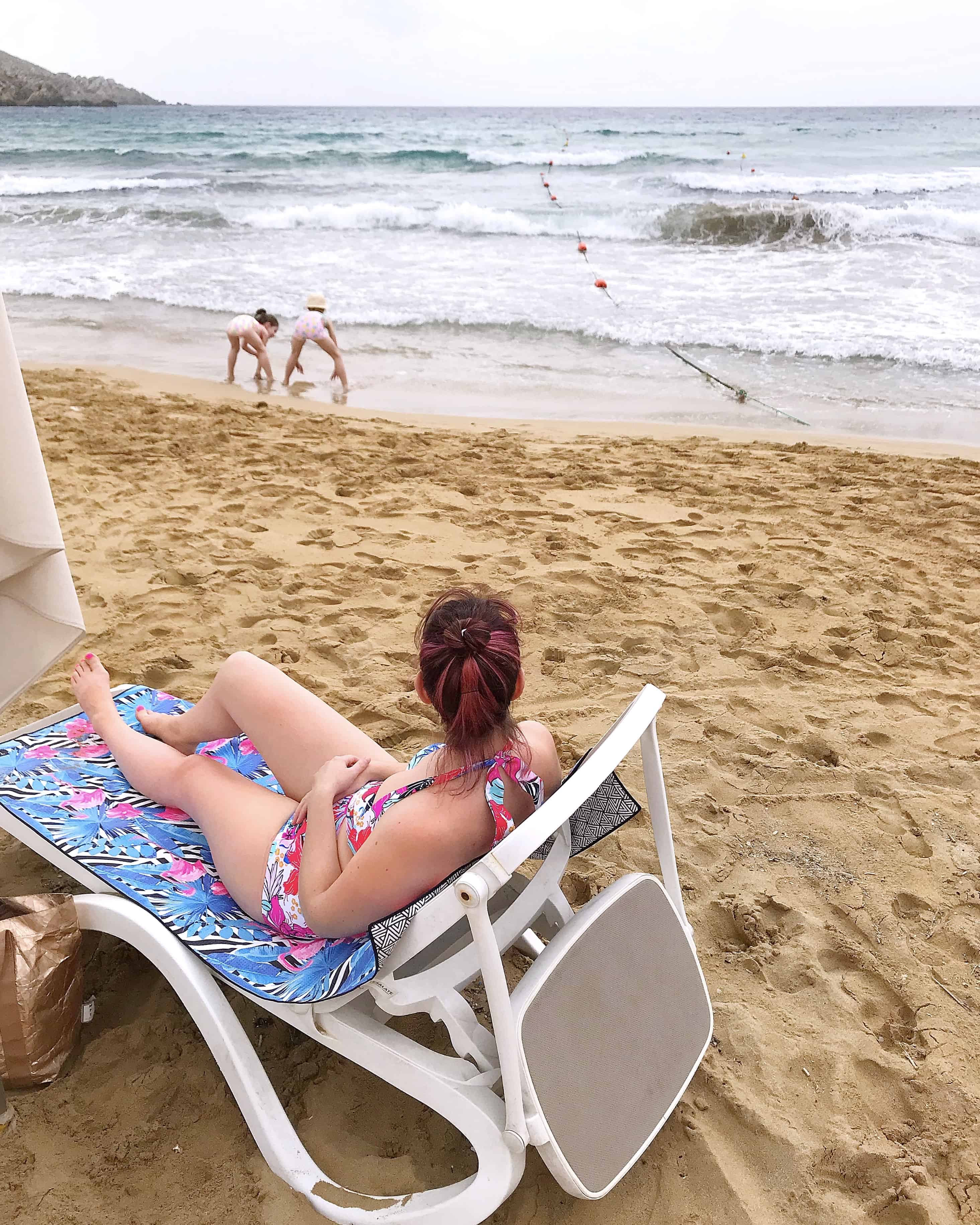 Relaxing on Golden Sands beach in Malta