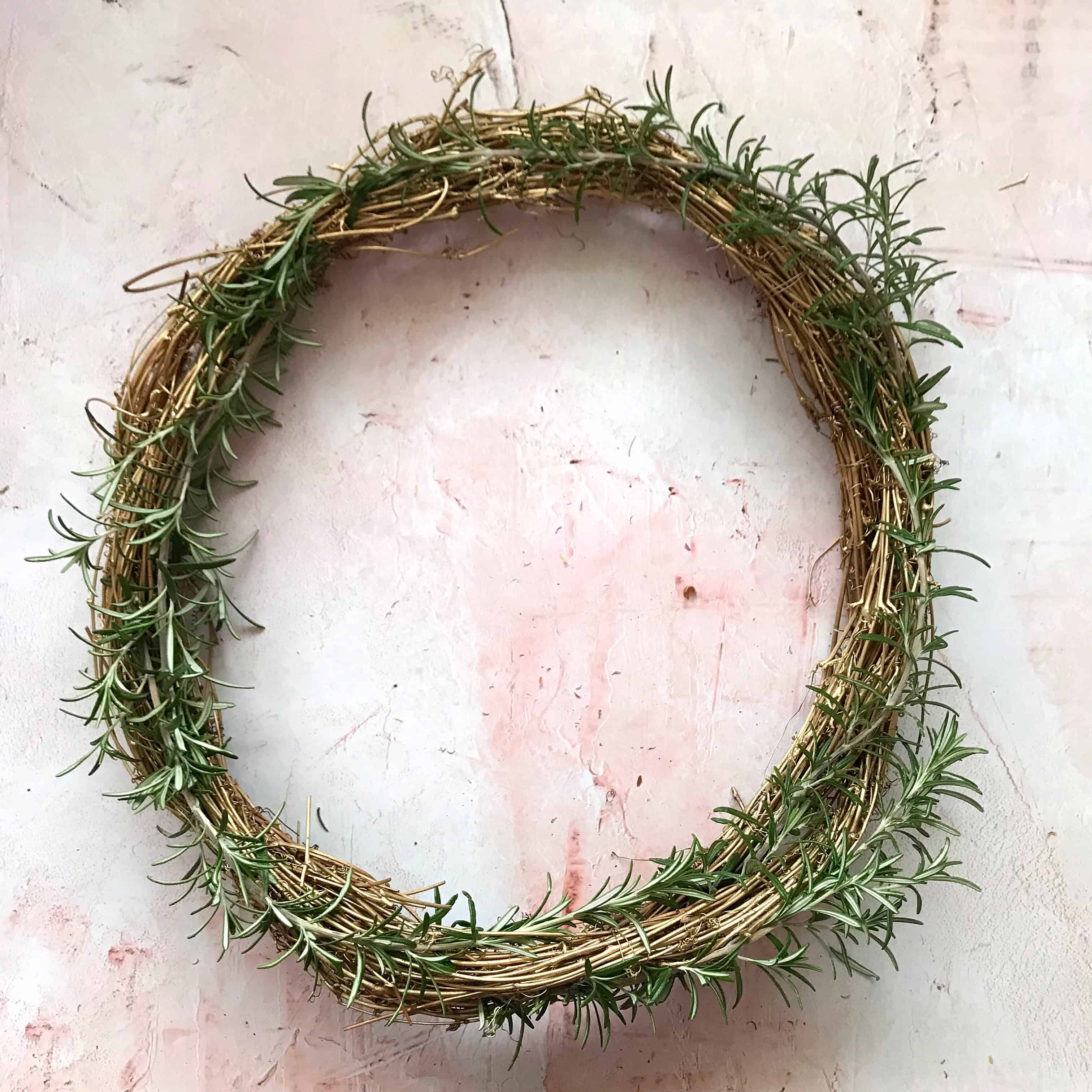 Step 3 to make an easy metallic wreath - attach greenery