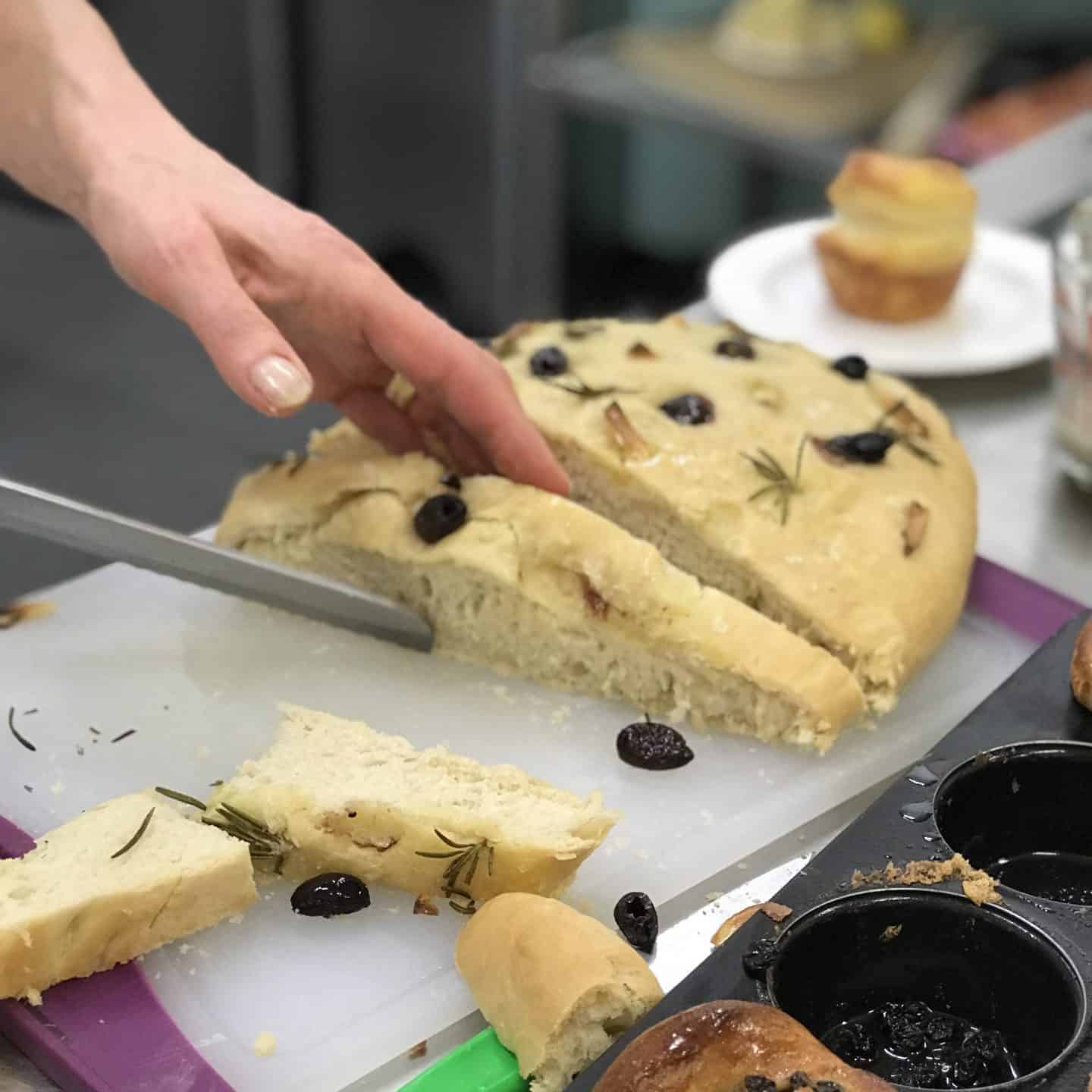 Freshly baked foccacia being sliced