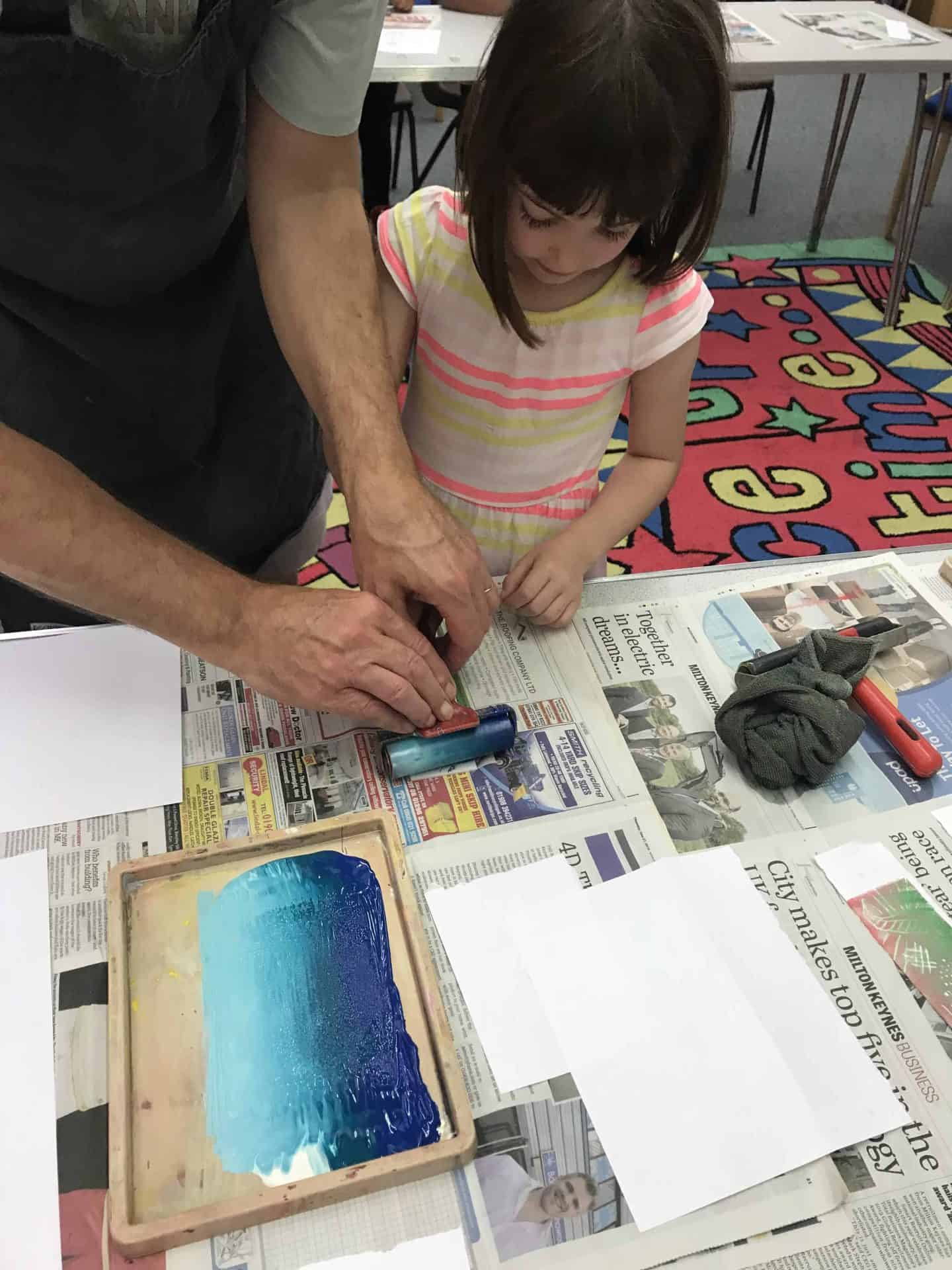 Applying ink to her polystyrene design