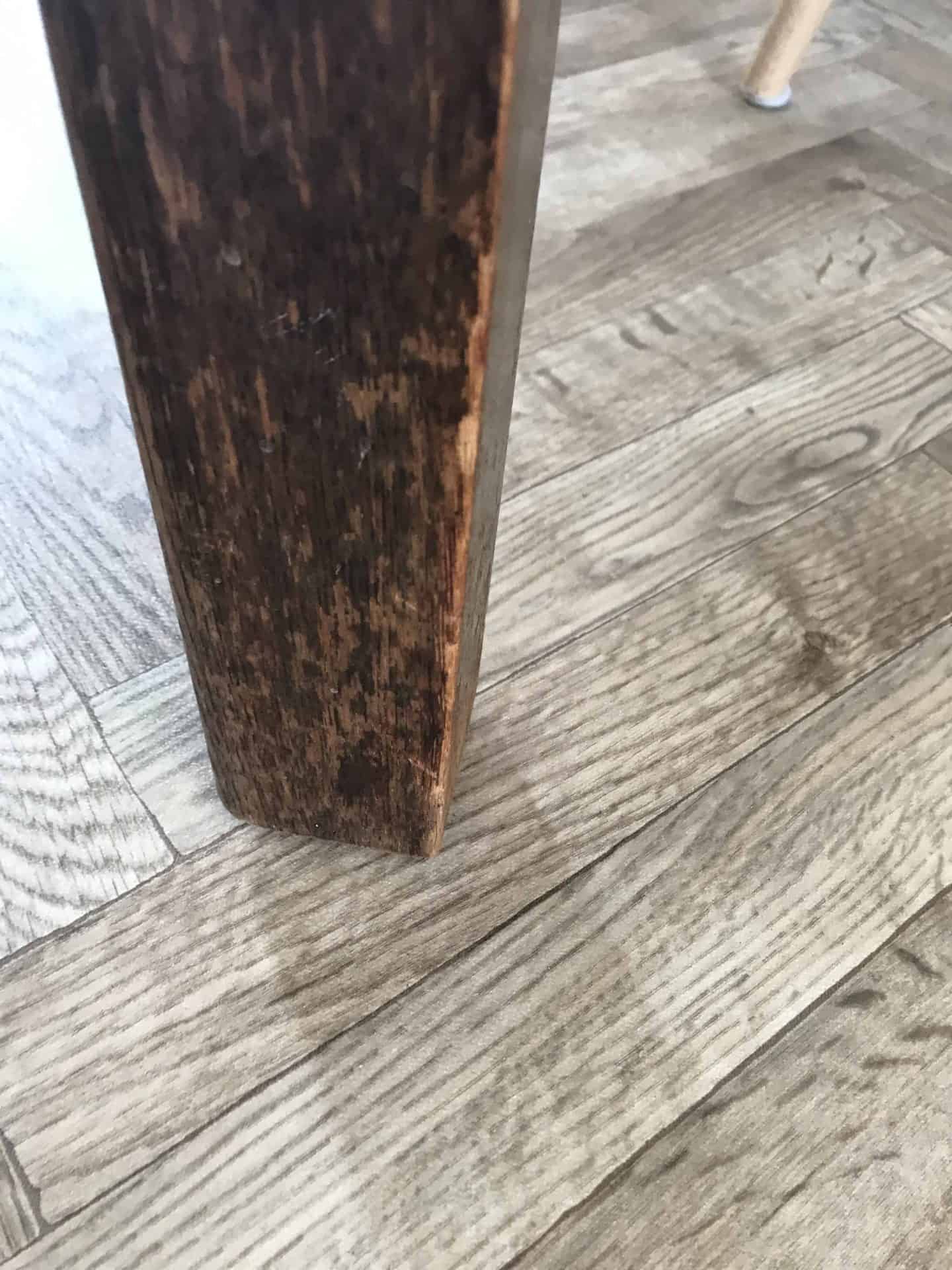 Scratched utility table leg