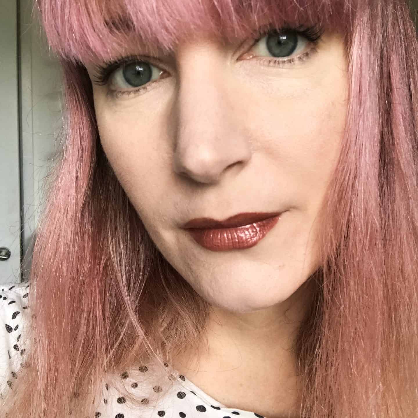 Becky Pink wearing Inika Lipglaze in Rosewood from the August Love Lula Natural Beauty Box