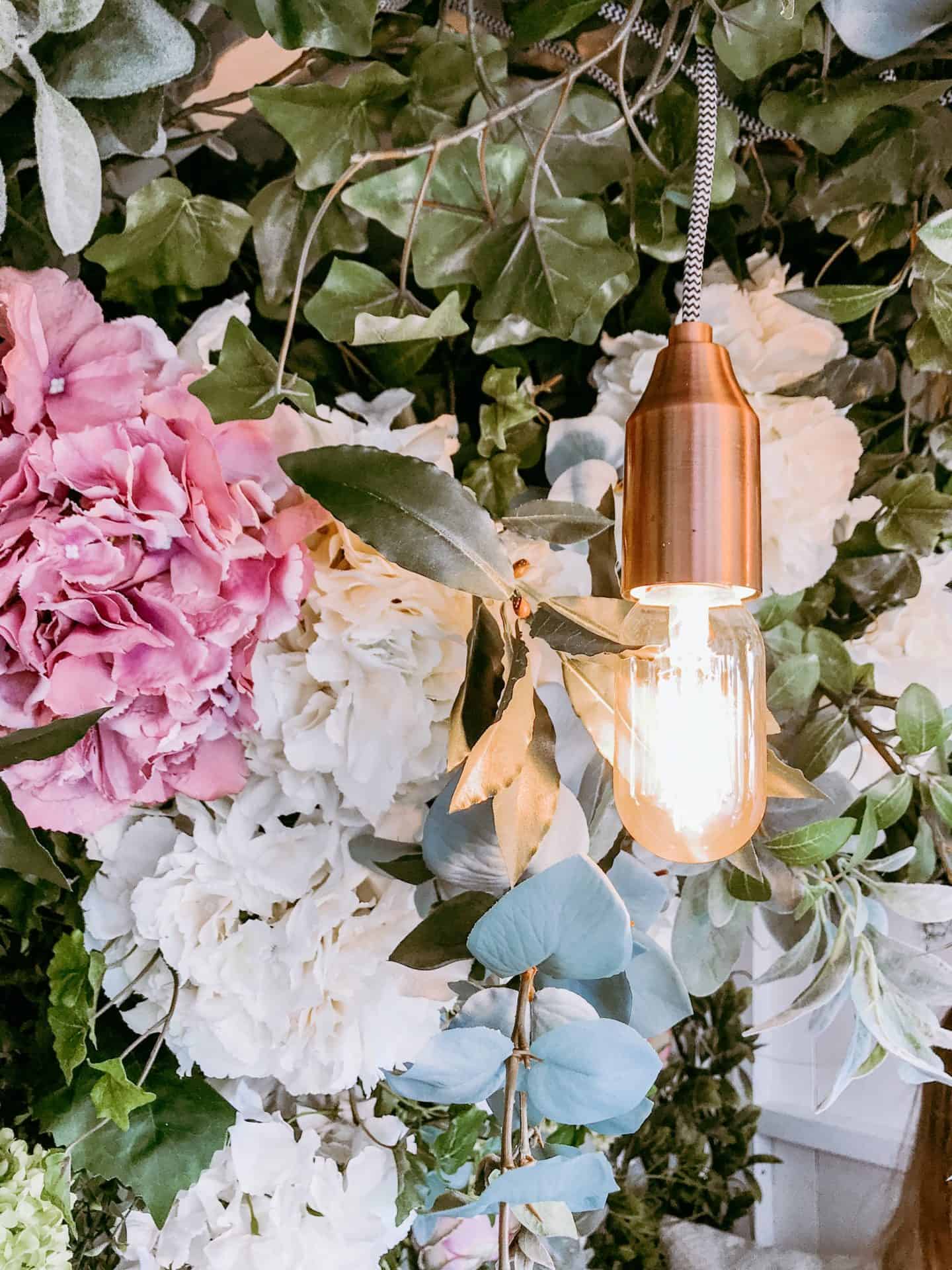 Copper lamp and flowers in the Garden Den