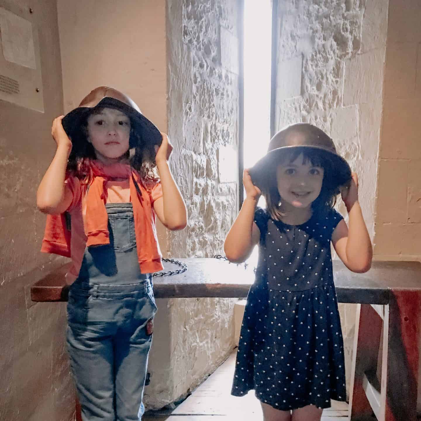 Trying on helmets at the Tower of London