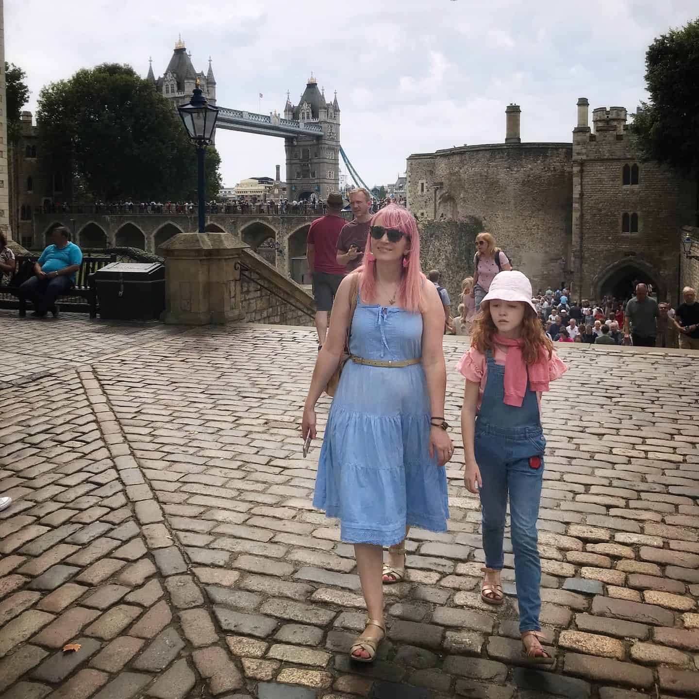 Walking around the Tower of London with Tower Bridge in the background