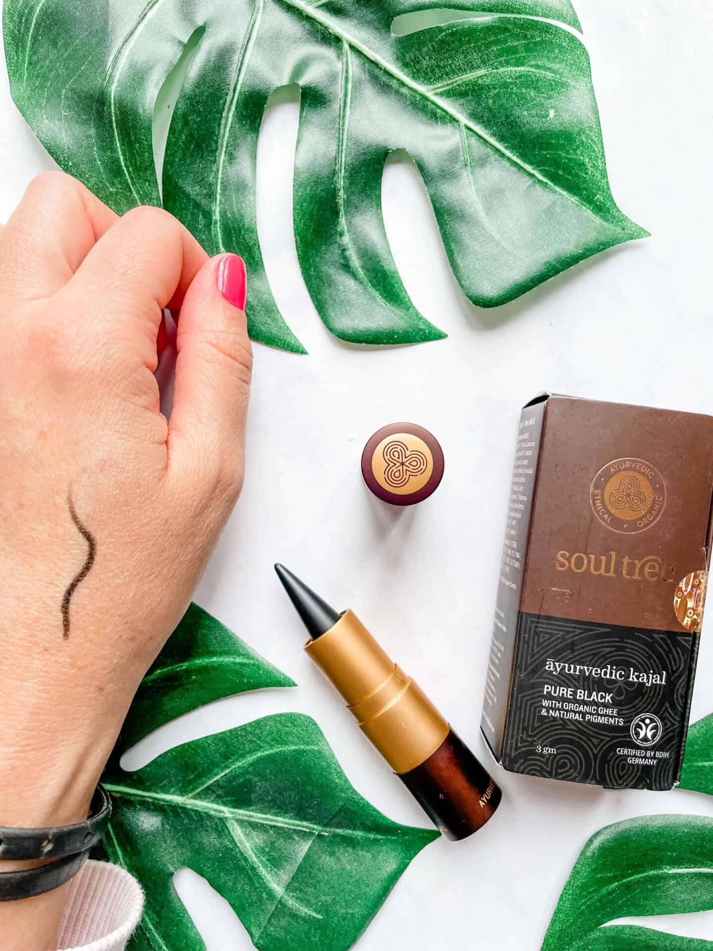 Soul Tree Ayurvedic Kajal in Pure Black on a hand