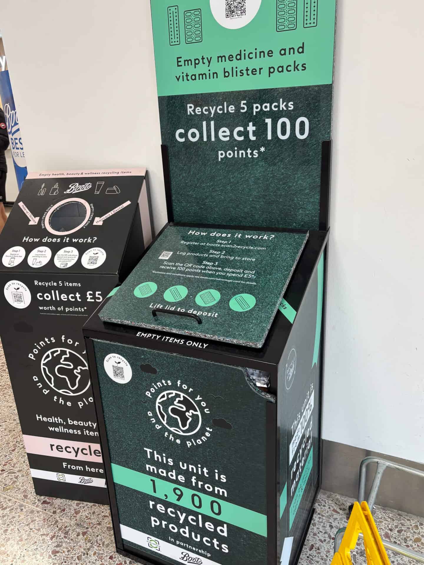 A recycling bin for vitamin and medication blister packs next to another one for beauty packaging