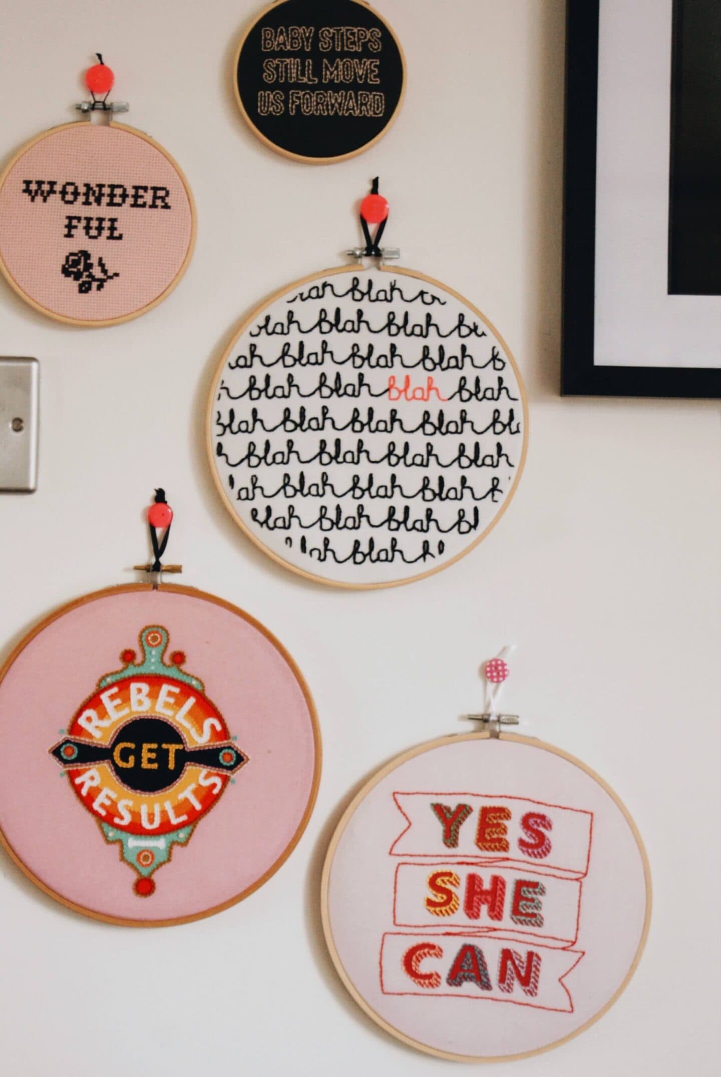 Embroideries in hoops on a wall
