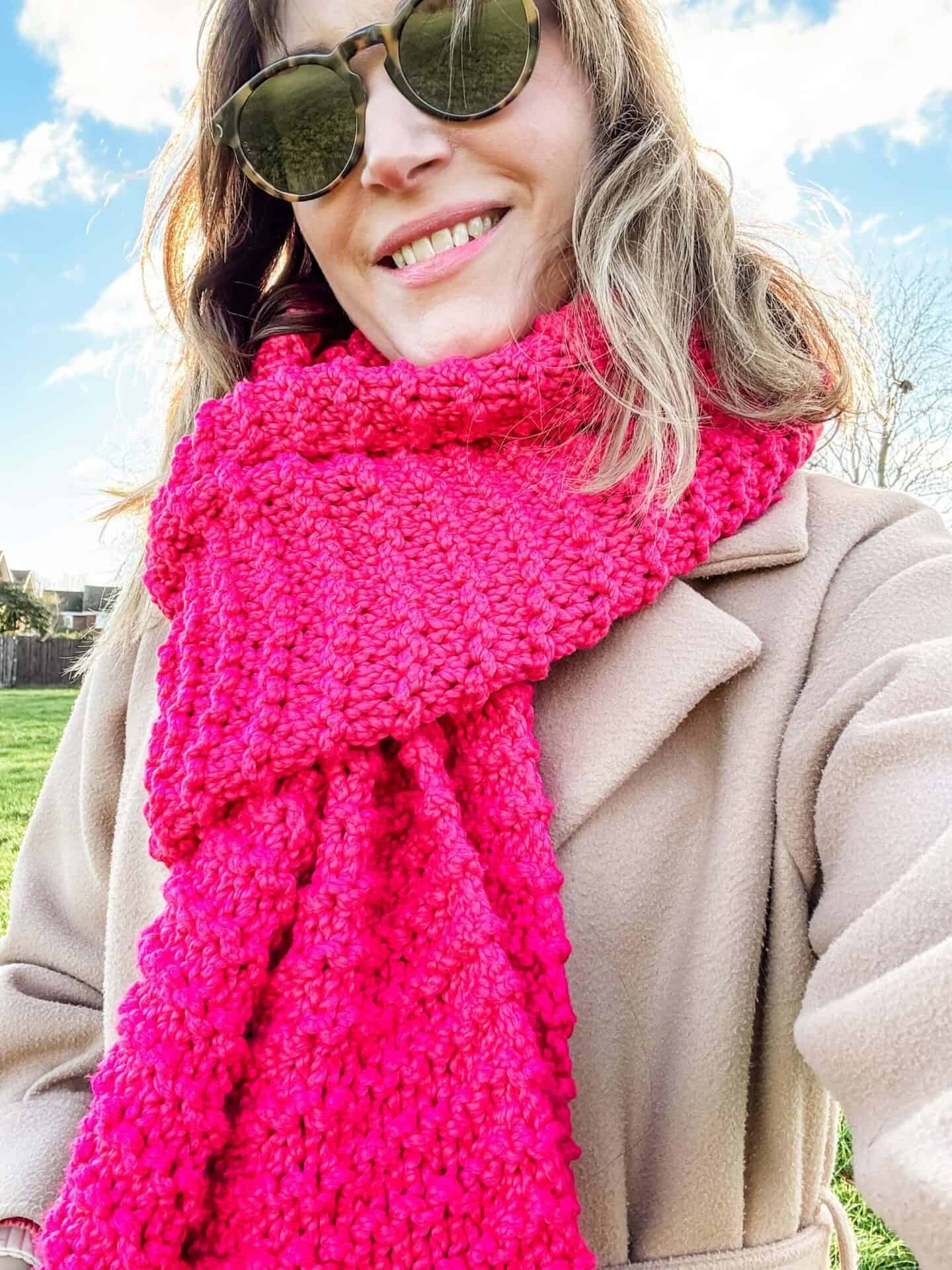 Me wearing my home-knitted hot pink scarf