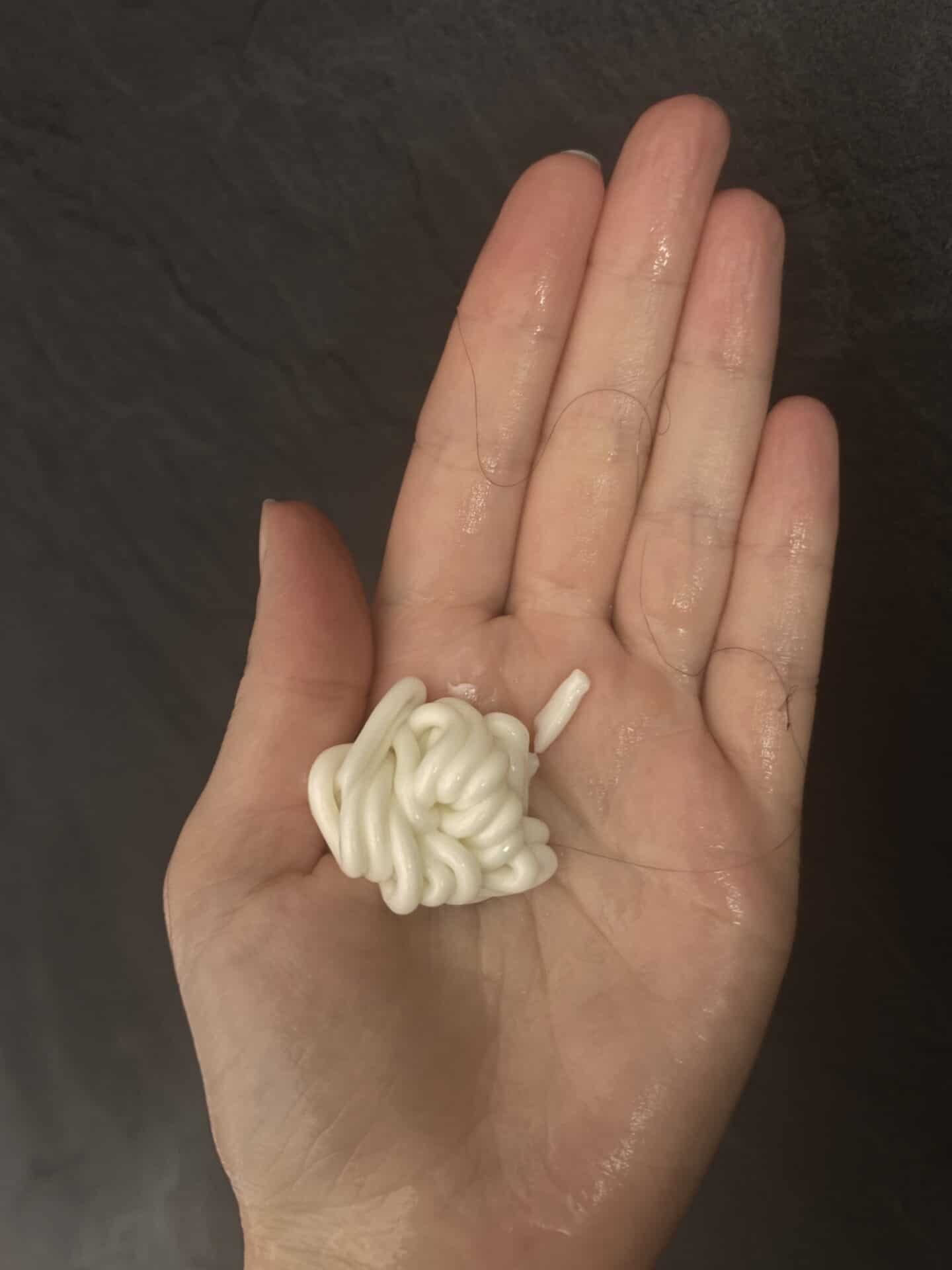 A blob of Madara Grow Volume Conditioner on a hand